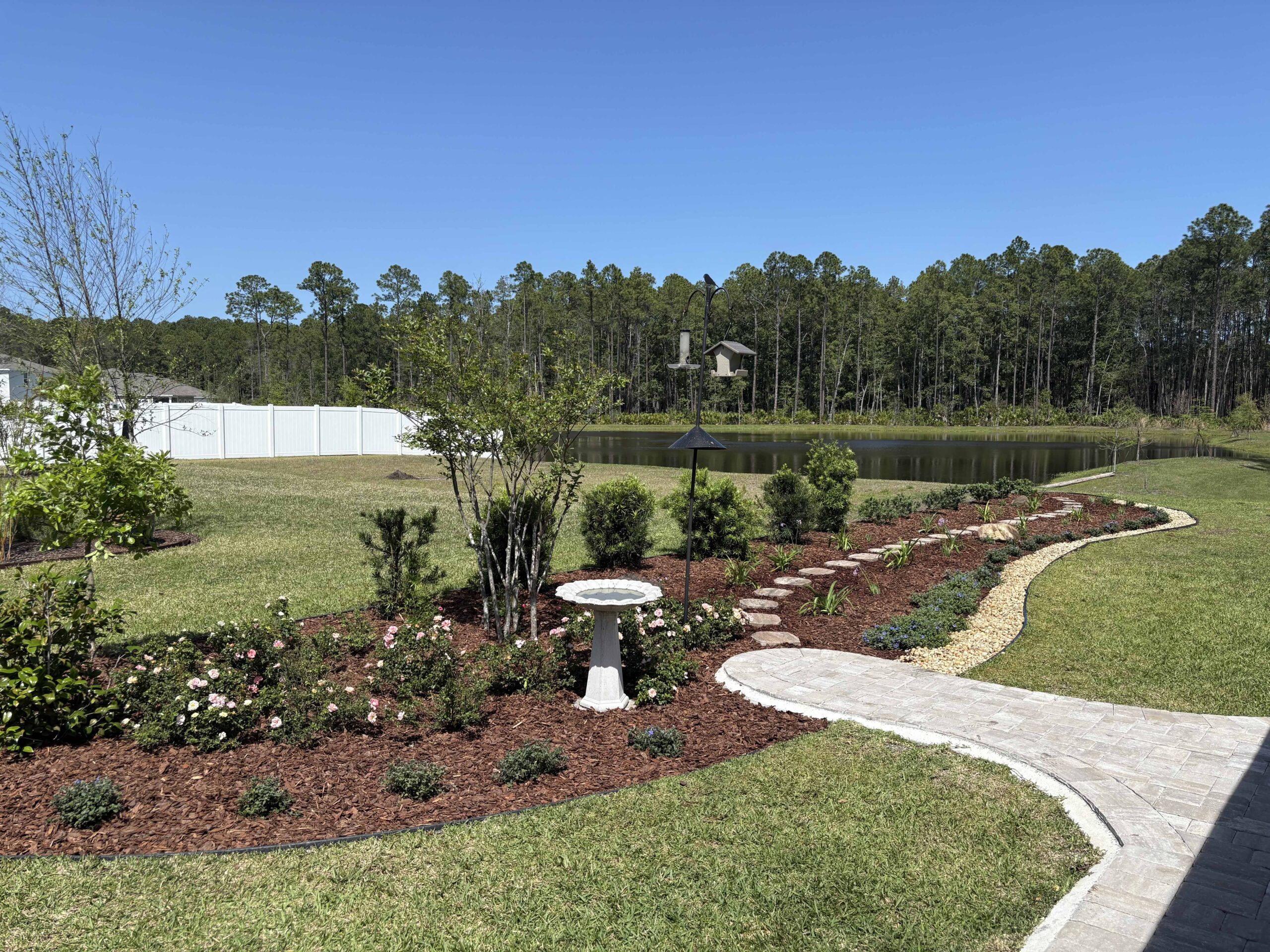 Complete outdoor living space with pavers, planting and lighting in St. Augustine, FL